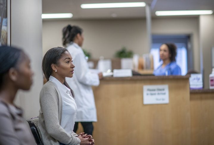 Patients waiting in the reception area of an outpatient psychiatric clinic