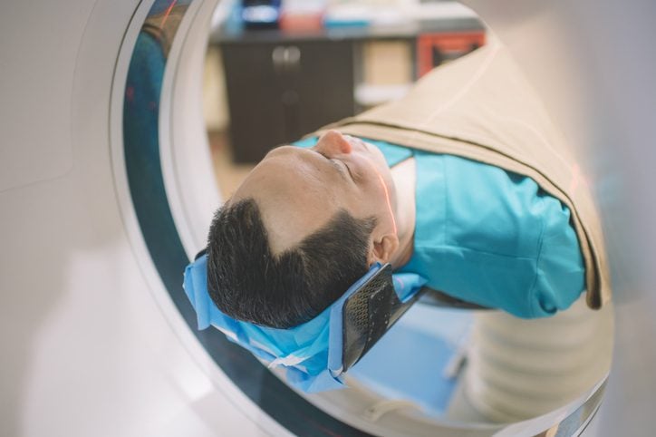 128-Slice CT Diagnostic Imaging – Flushing Hospital Man undergoing a CT scan in a diagnostic imaging room