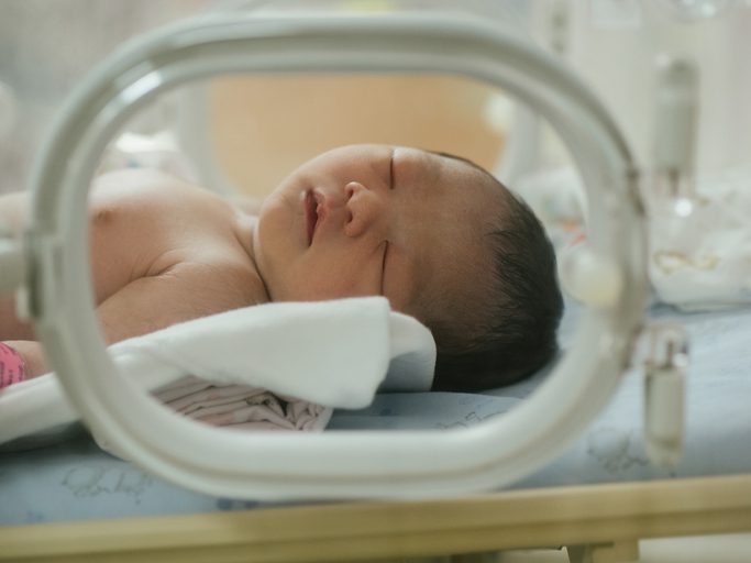 Neonatal Intensive Care Unit (NICU) – Flushing Hospital Newborn baby sleeping inside an incubator in the NICU