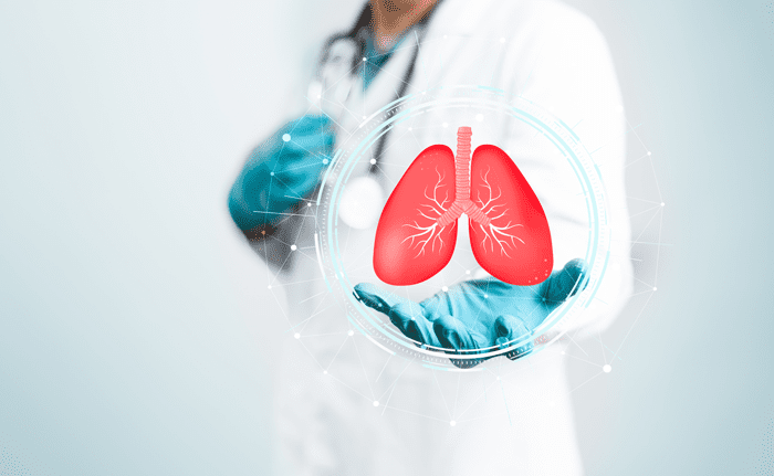 Doctor holding a lab container with a lung model in a pulmonary laboratory